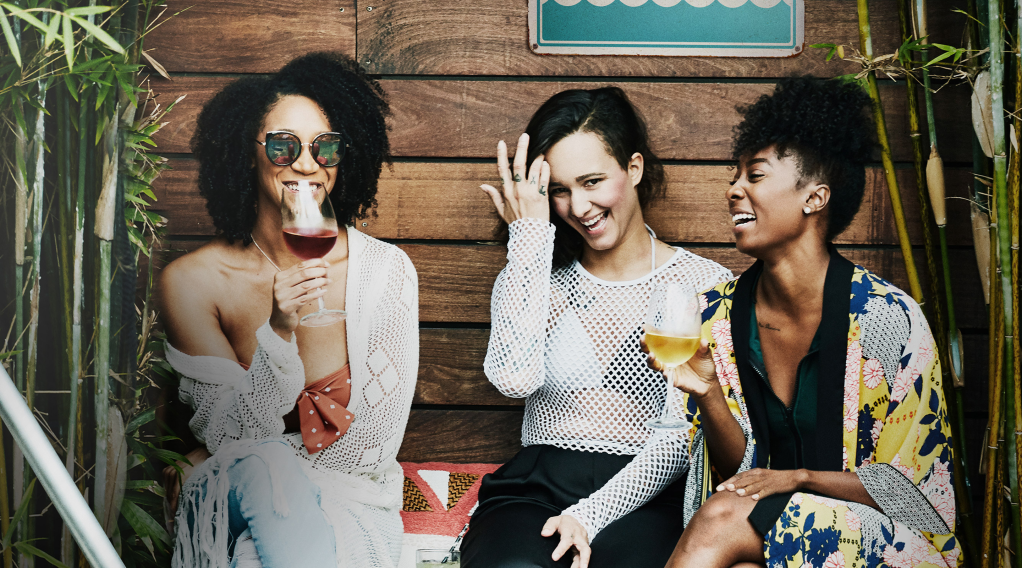 Three people drinking wine together