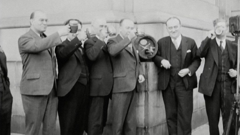 Old vintage photograph of men drinking wine
