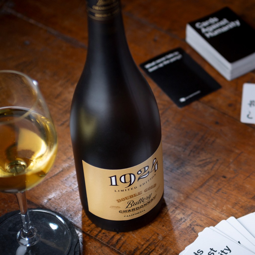 Photo of the 1924 Chardonnay on a table with various playing cards